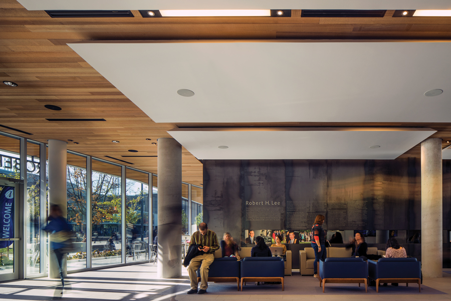 A generous lounge space invites students and alumni to mix and mingle throughout the day and provides ample room for gathering before official functions upstairs. Photo: Nic Lehoux