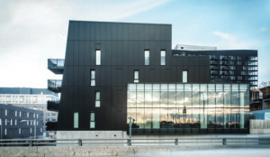 The tower is subtly articulated with a vertically tapered volume.