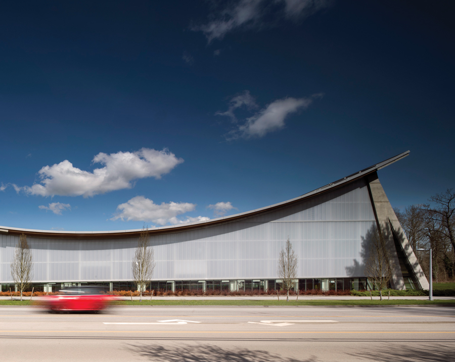 The sweeping profile of the new aquatic centre creates a strong presence along 24 Avenue in Surrey, B.C. Photo by Nic Lehoux